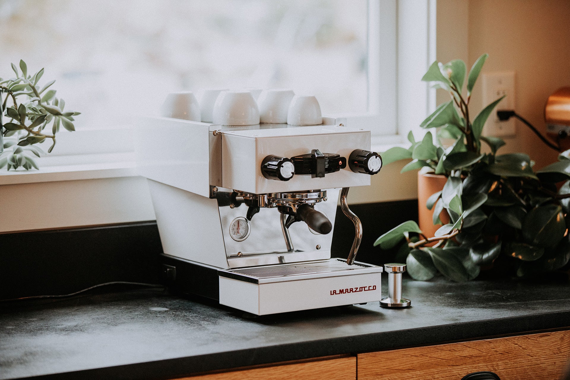 La Marzocco Linea Micra Espresso Machine in white. Front view of the machine.