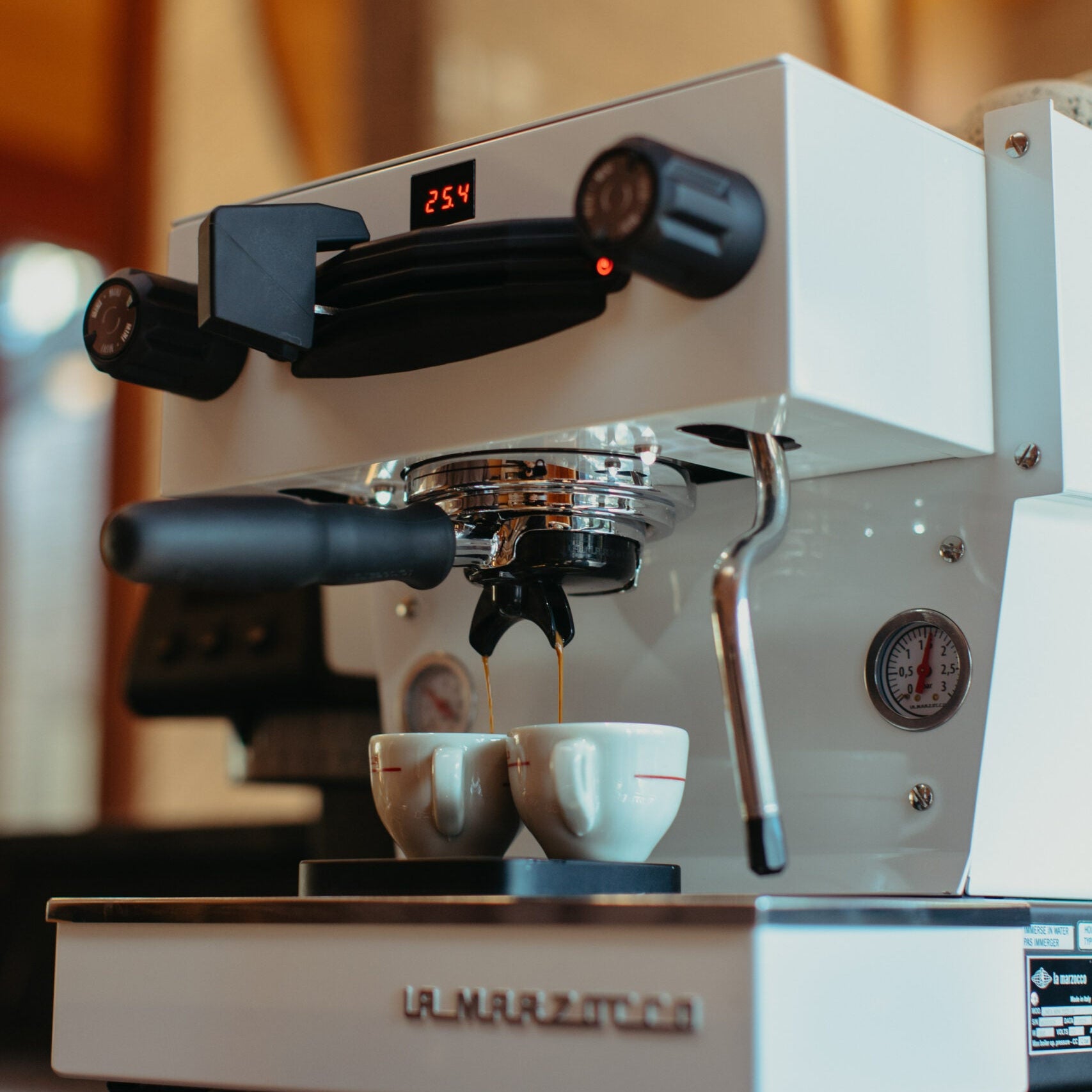 La Marzocco Linea Mini Espresso Machine. Front view of the machine in white.