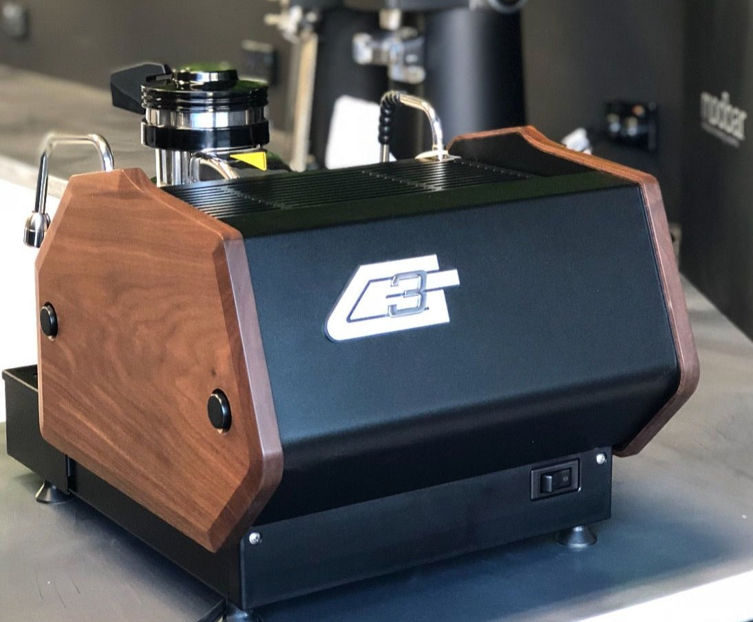 La Marzocco GS3 MP Flat Black Walnut Edition Espresso Machine. Back view of the machine.