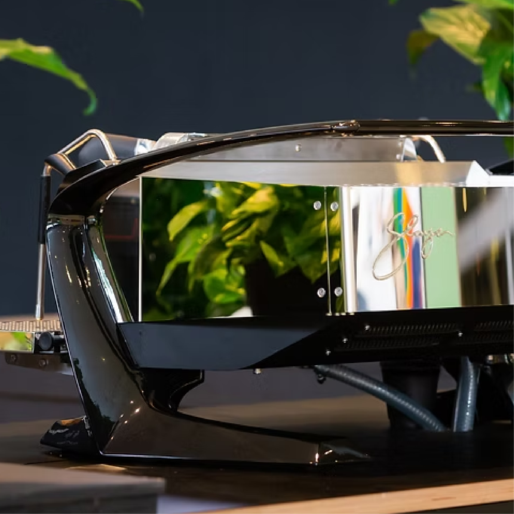 Slayer Steam LP Commercial Espresso Machine with mirror-polished steel body panels. Back view of the machine.