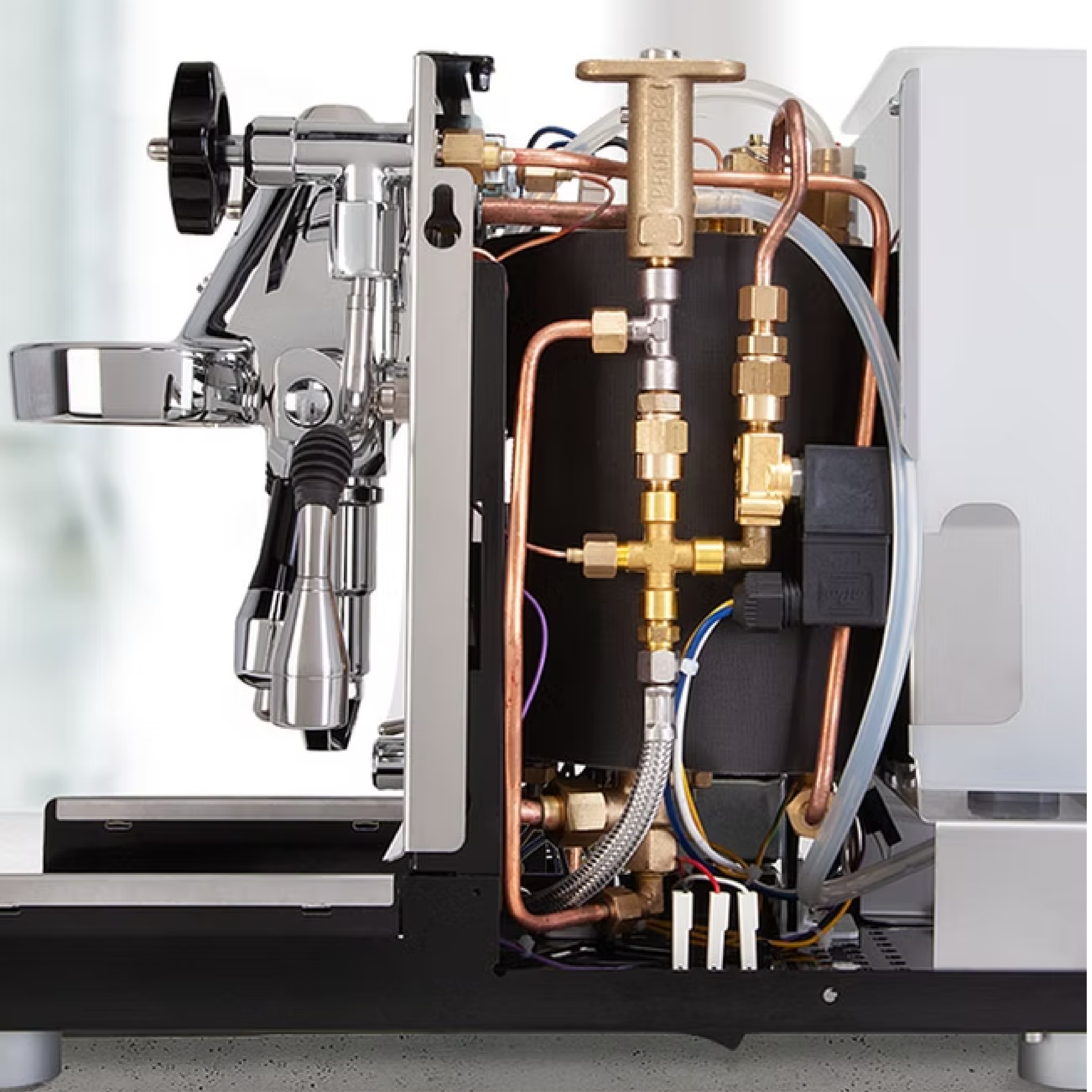 ECM Mechanika VI Slim Espresso Machine. Side internal view showing insulated copper boiler and brass plumbing.