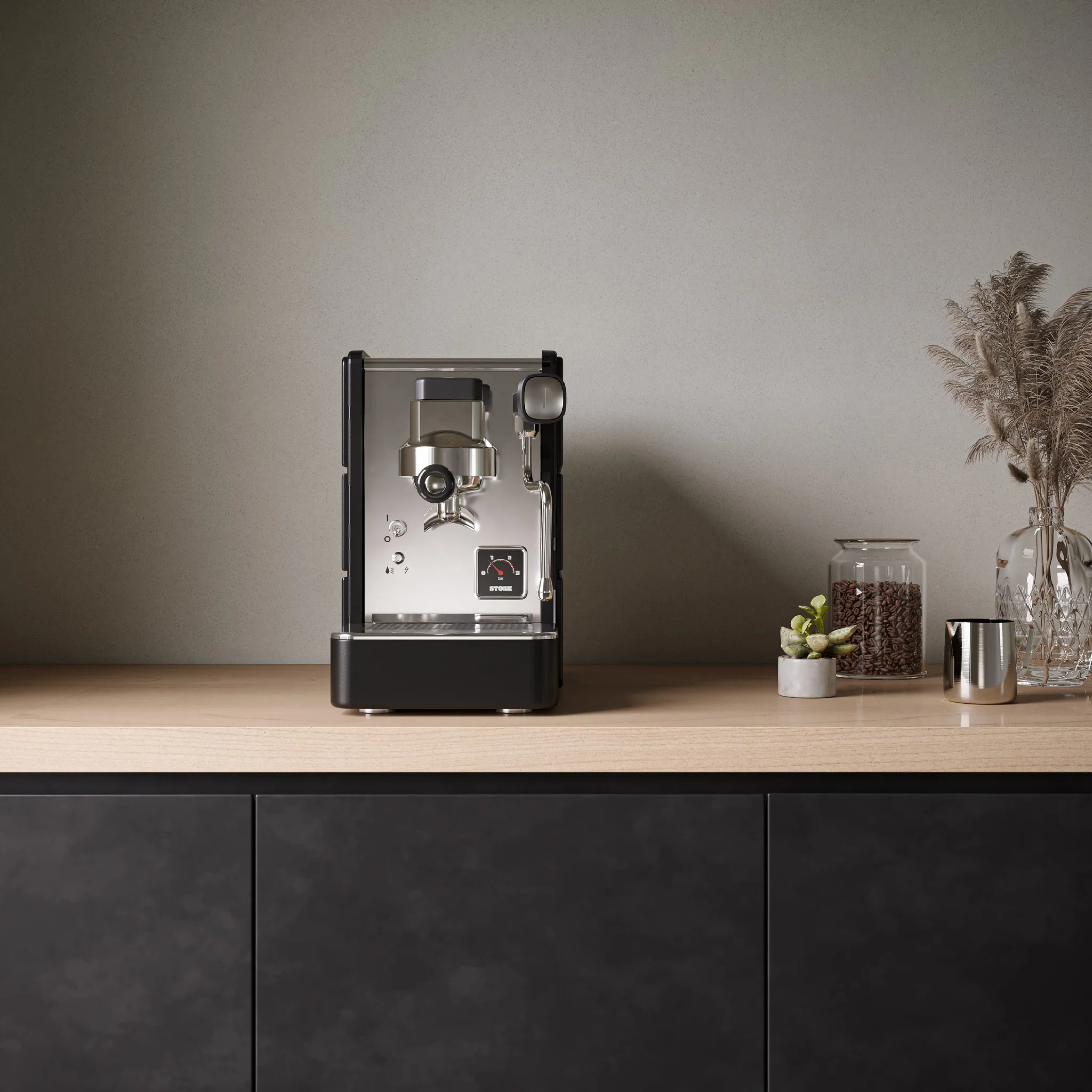 Stone Espresso Machine in plus black. Front view of the machine on countertop.